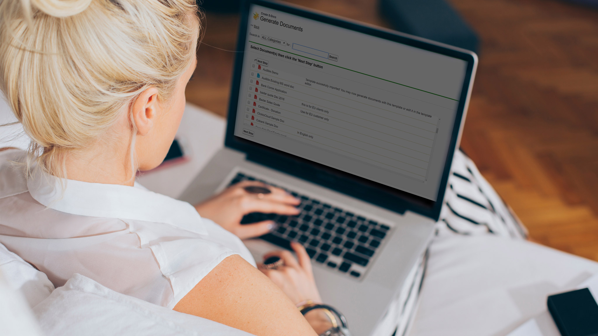 Woman working on laptop using S-Docs